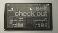 a sign that says self check out